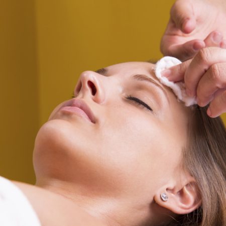 Woman is having cosmetic treatment at beauty salon.